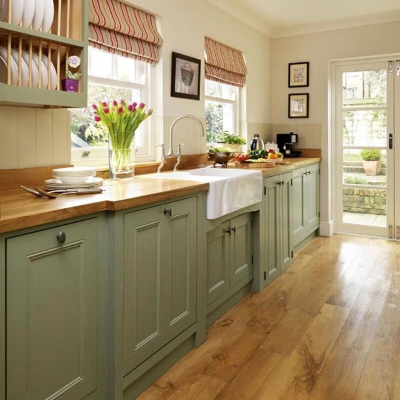 Pistachio kitchen with a wooden countertop