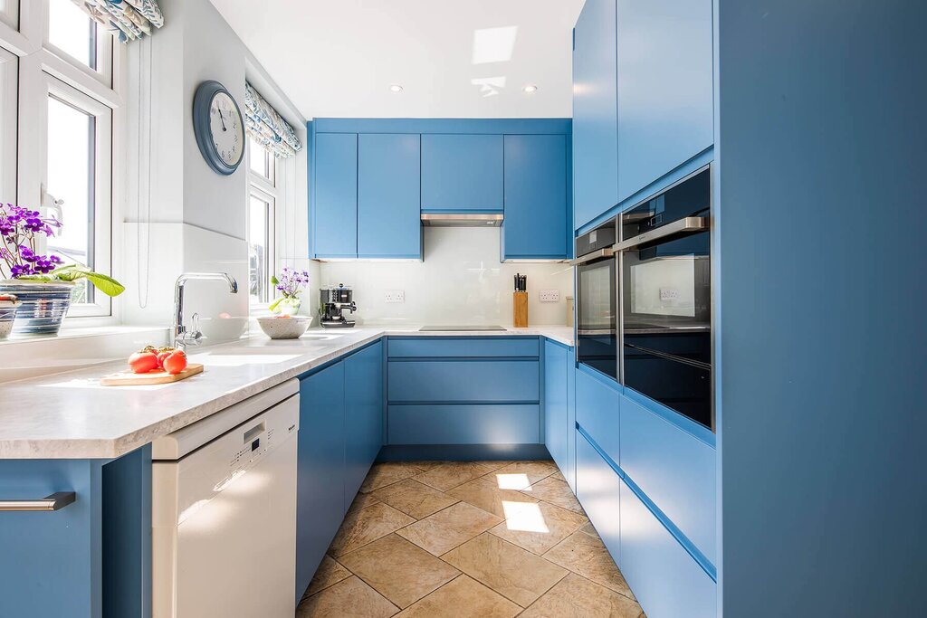 A blue kitchen in the interior