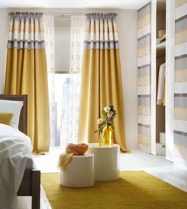 Mustard curtains in the bedroom interior