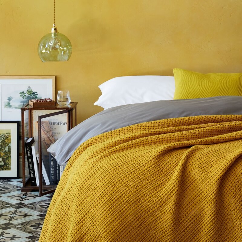 Mustard color in the bedroom interior