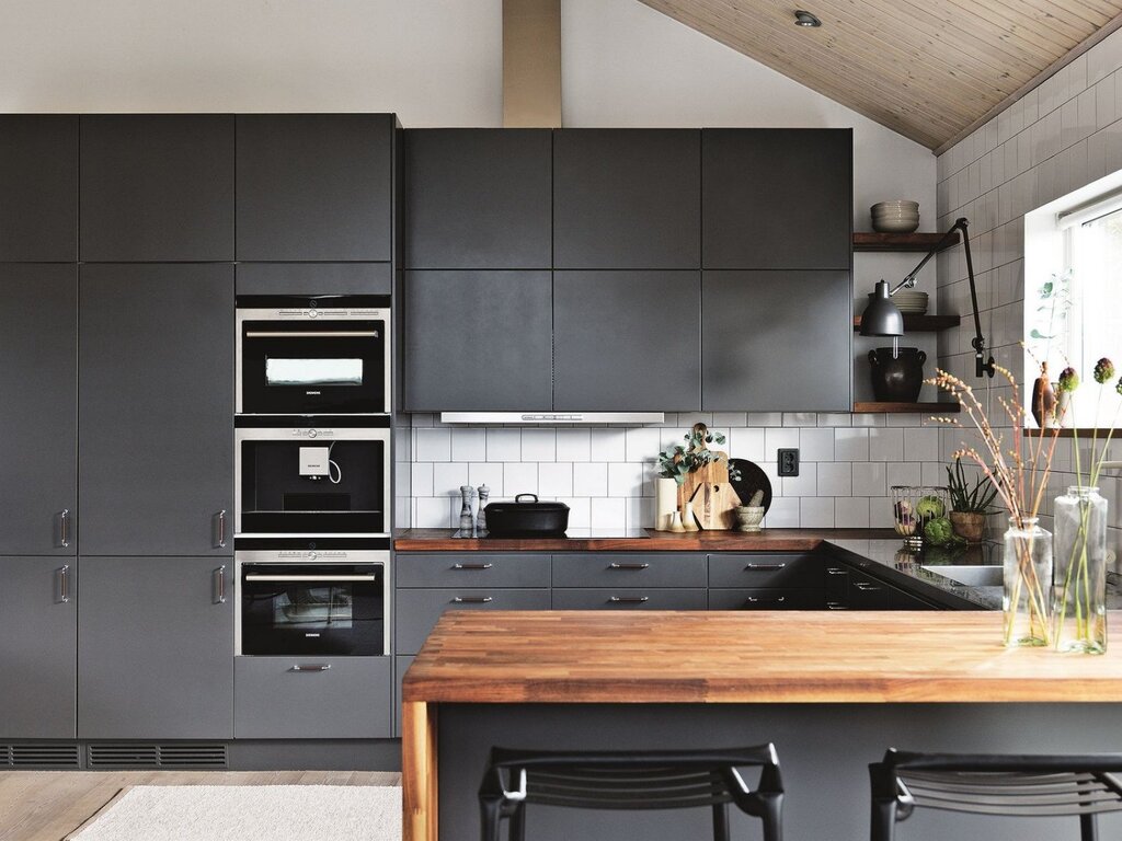 Graphite kitchen with a wooden countertop