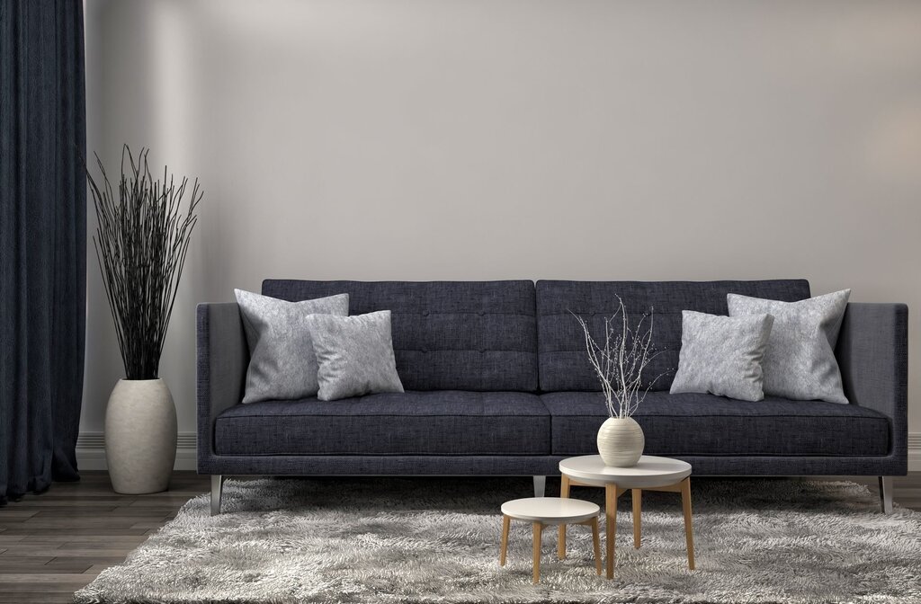 A graphite sofa in the living room interior