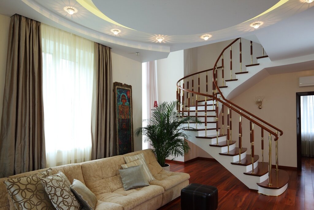 The interior of a living room with a staircase