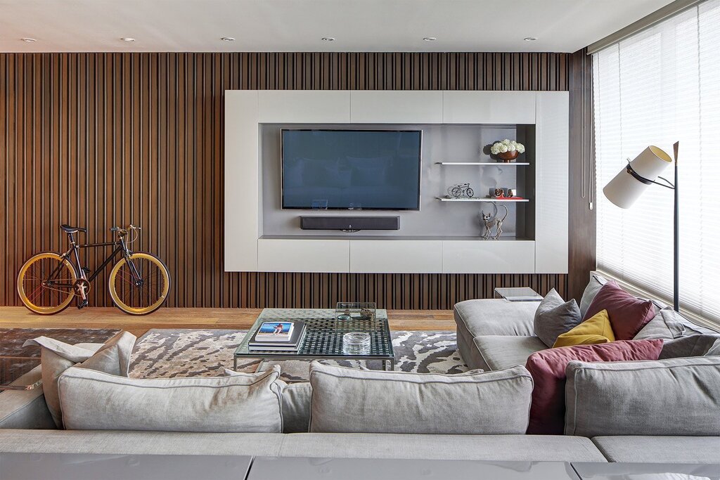 The interior of the living room with a TV on the wall