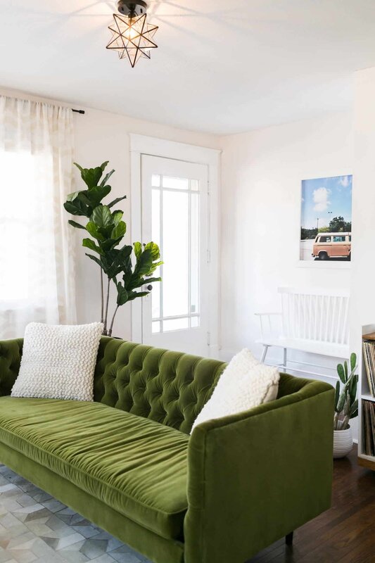 The interior of a room with a green sofa