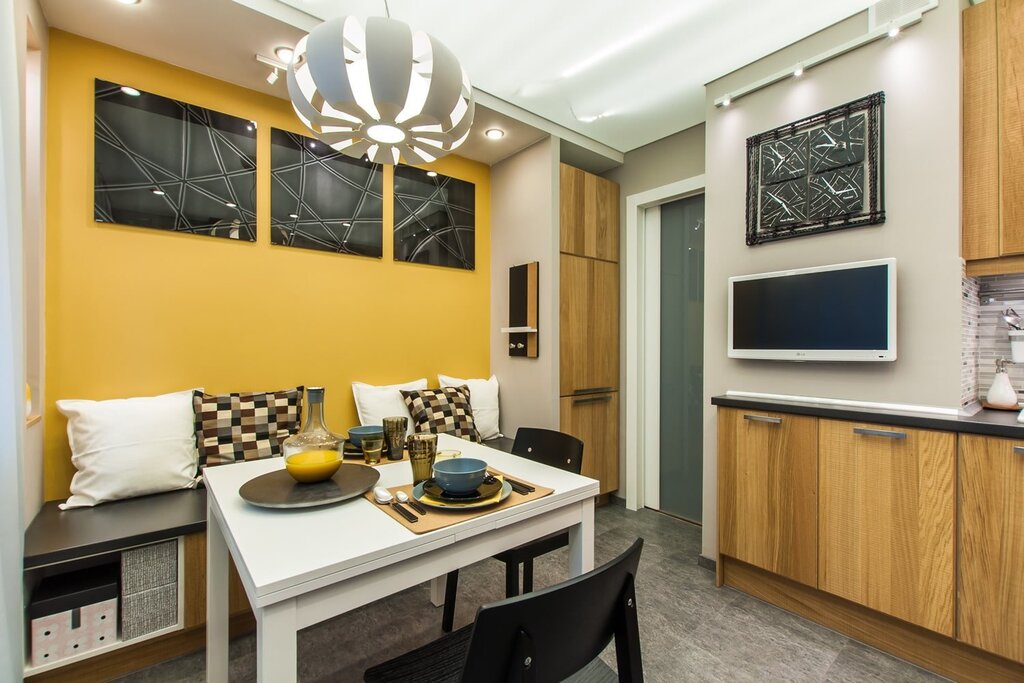 Kitchen interior with a TV on the wall