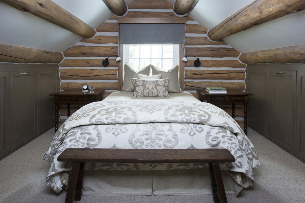 The interior of a bedroom in a log house