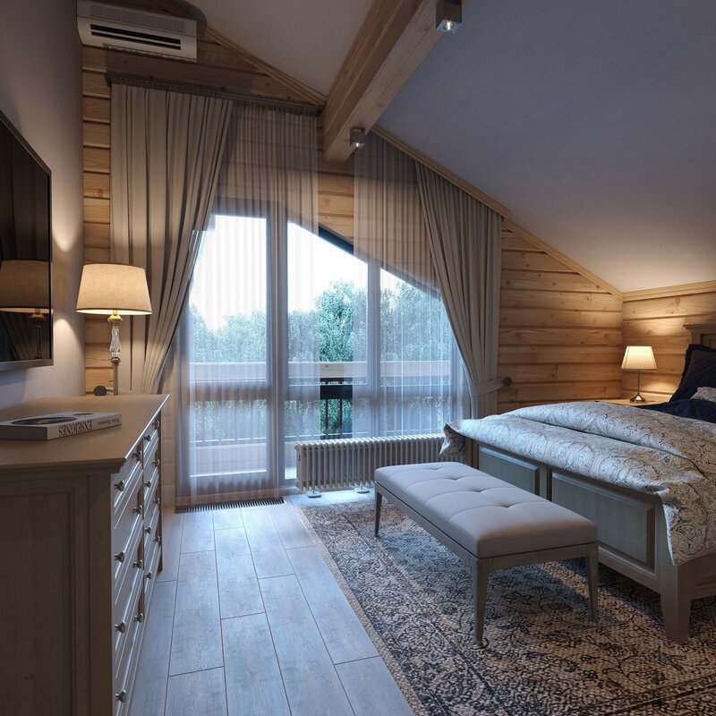 The interior of a bedroom in a wooden house