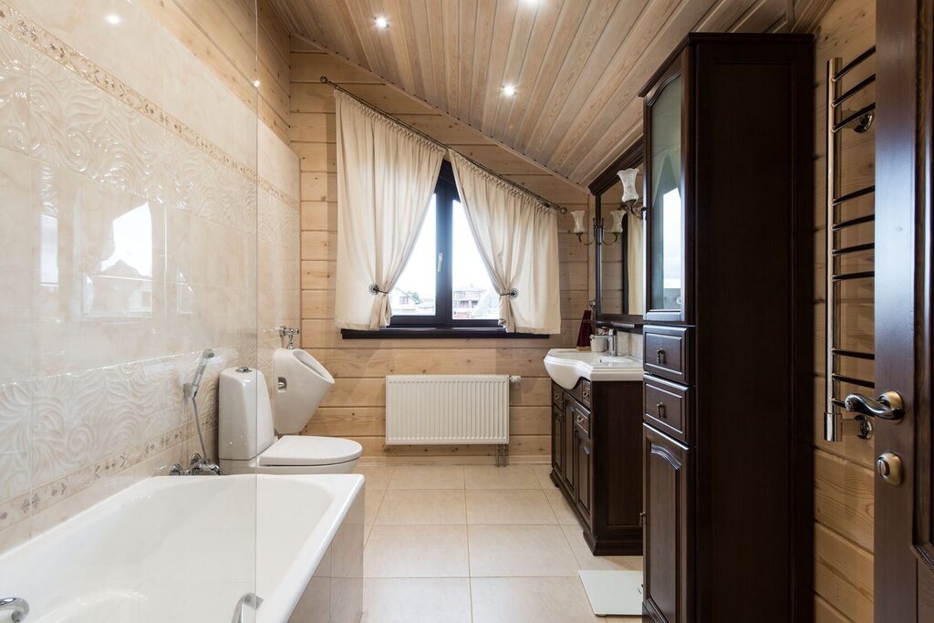 The interior of the bathroom in a wooden house