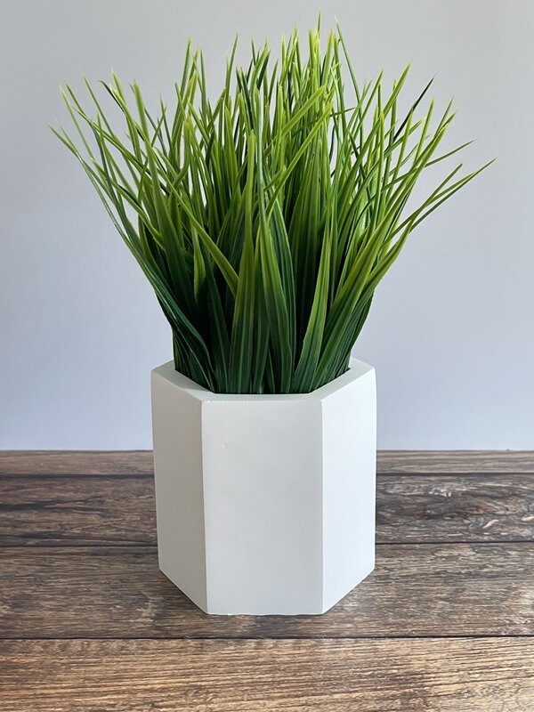 Artificial grass in a pot for decoration