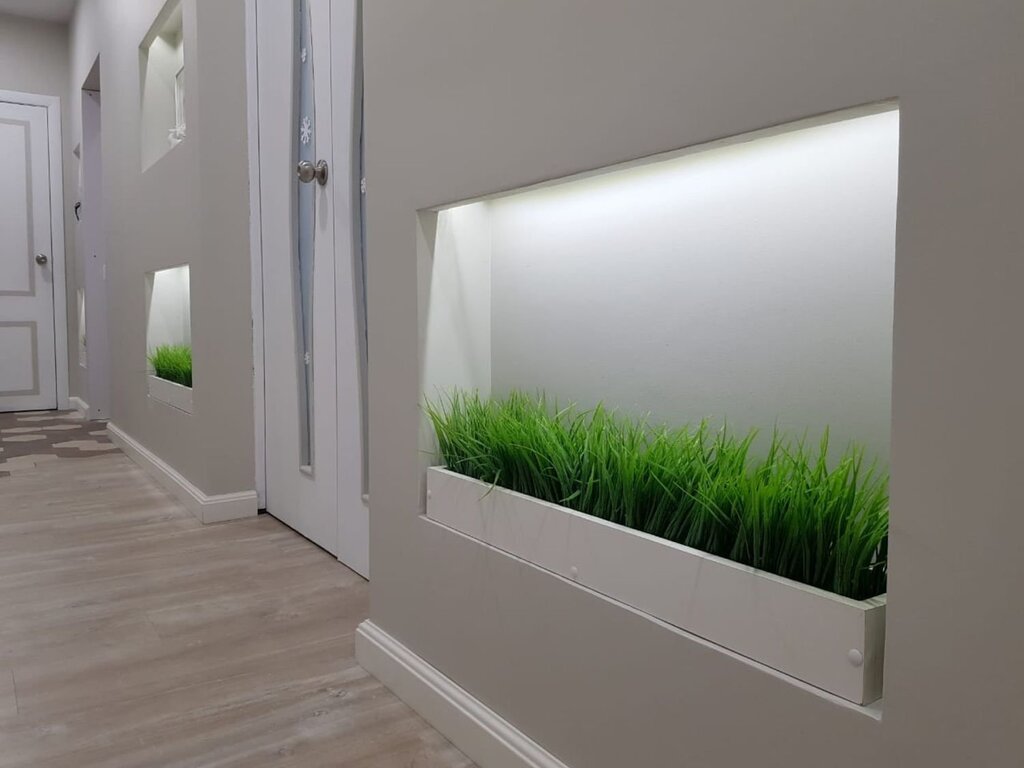 Artificial grass in the apartment interior