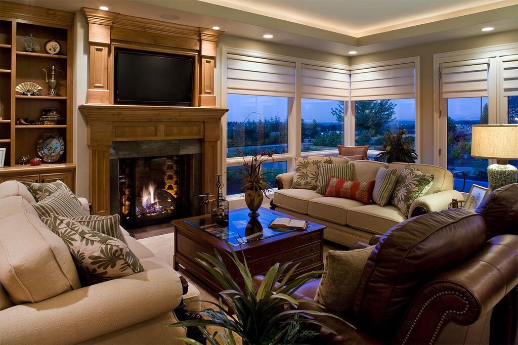 A fireplace between two windows in the living room