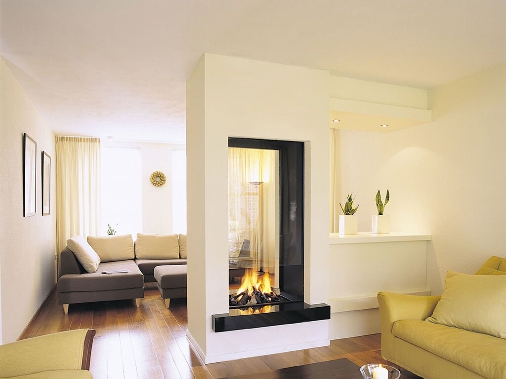 A fireplace in the middle of the living room