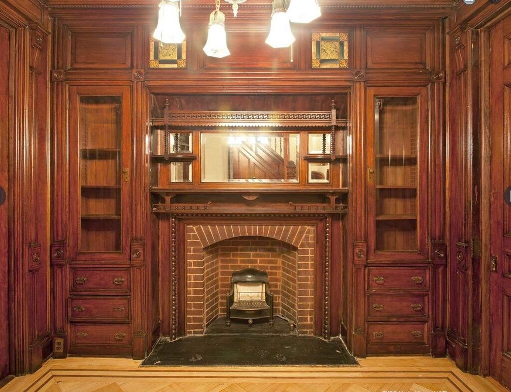 A Victorian-style fireplace