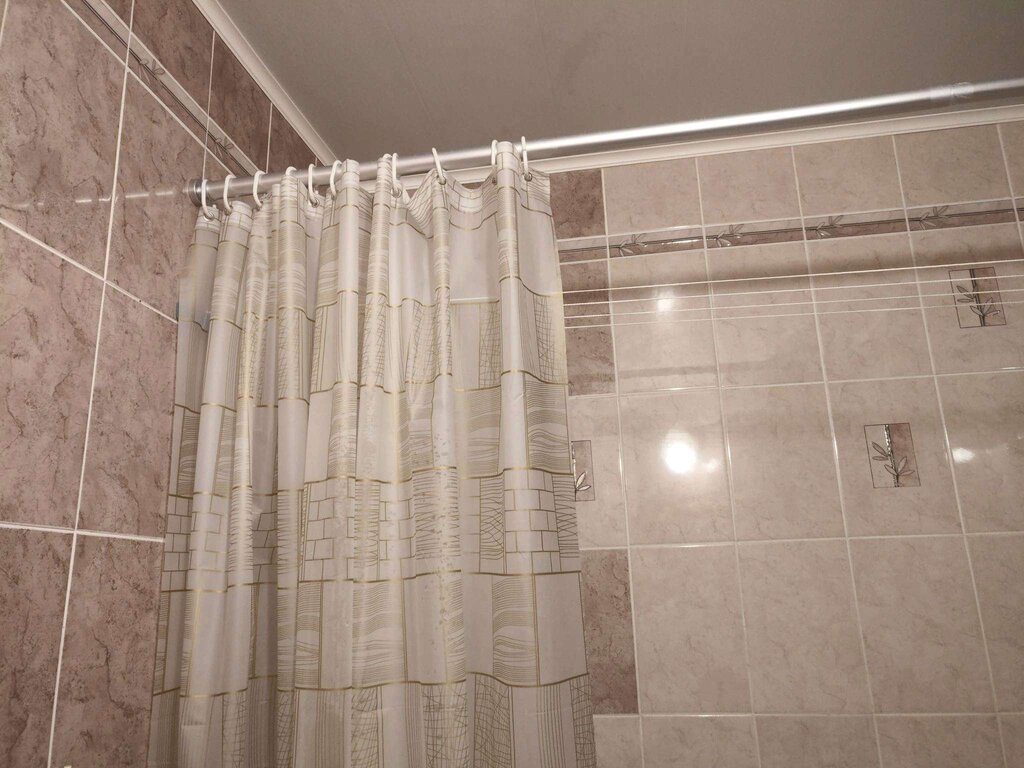 Shower curtain rod