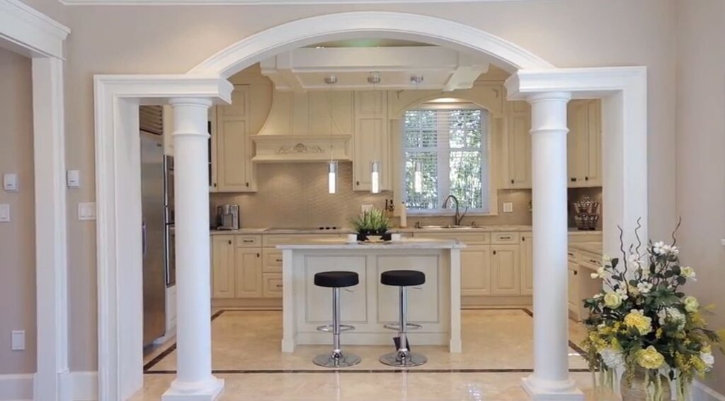 Columns in the interior of the living room with a kitchen