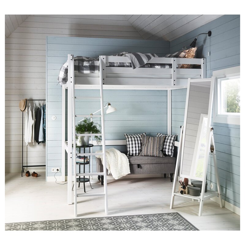 A room with a loft bed