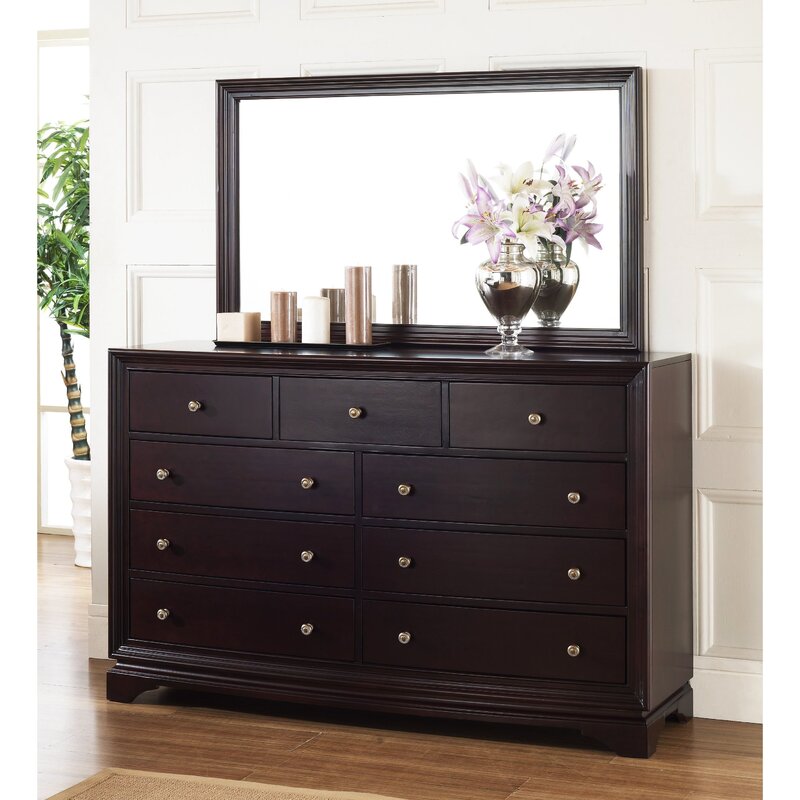 A dresser with a mirror for the hallway