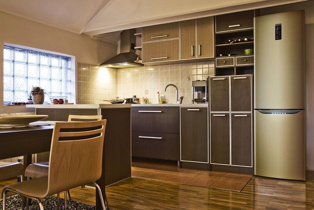 A brown refrigerator in the kitchen interior