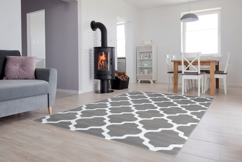 The rug is white with a diamond pattern