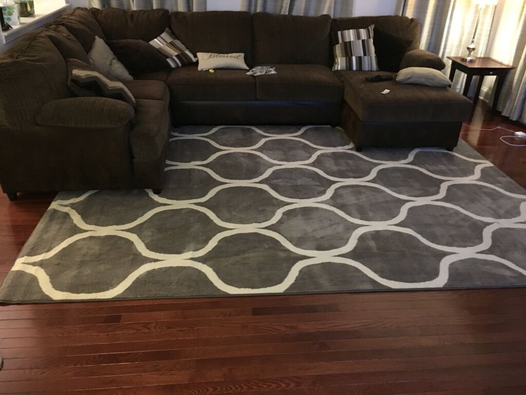 The rug is gray with brown