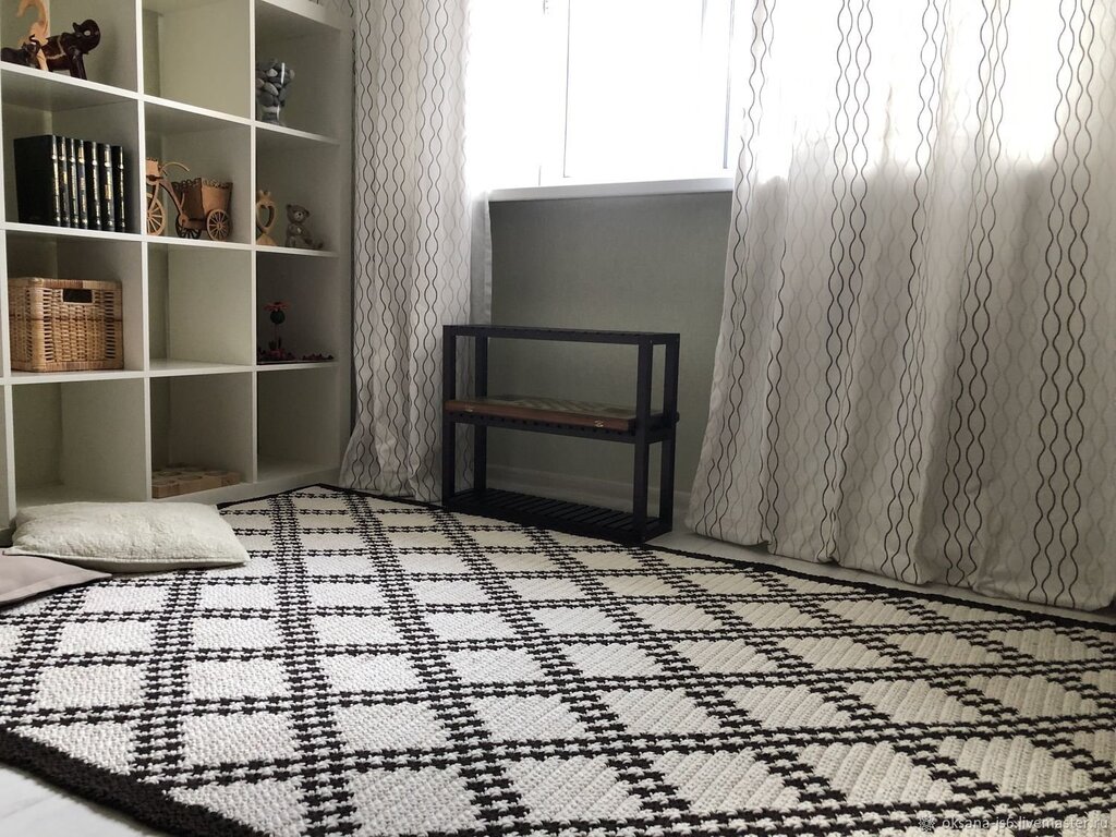 A black and white checkered rug