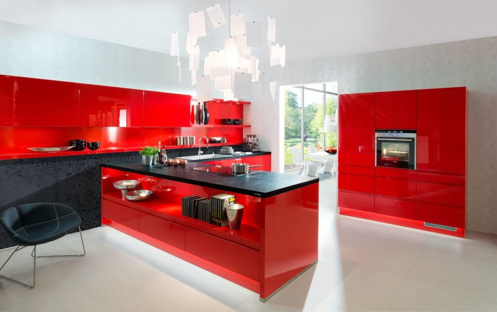 Red kitchen with a black countertop