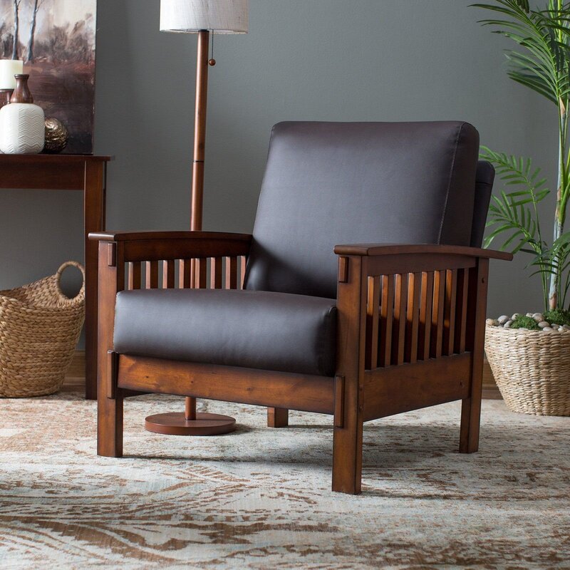 An armchair with wooden armrests in the interior