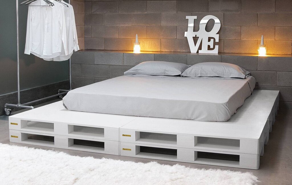 A bed made of a mattress and pallets