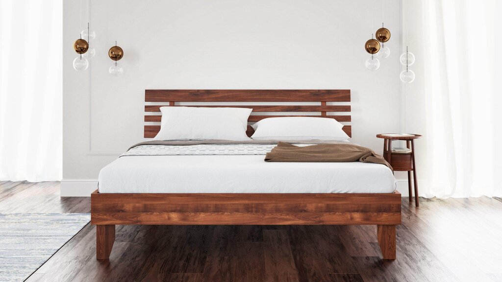 Bed with a wooden headboard