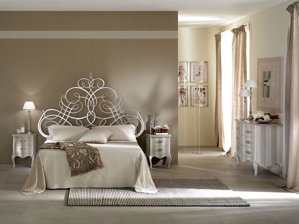 Bed with a wrought-iron headboard