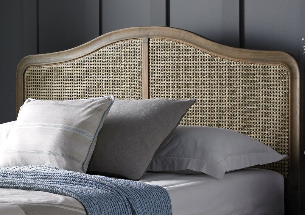 Bed with a woven headboard