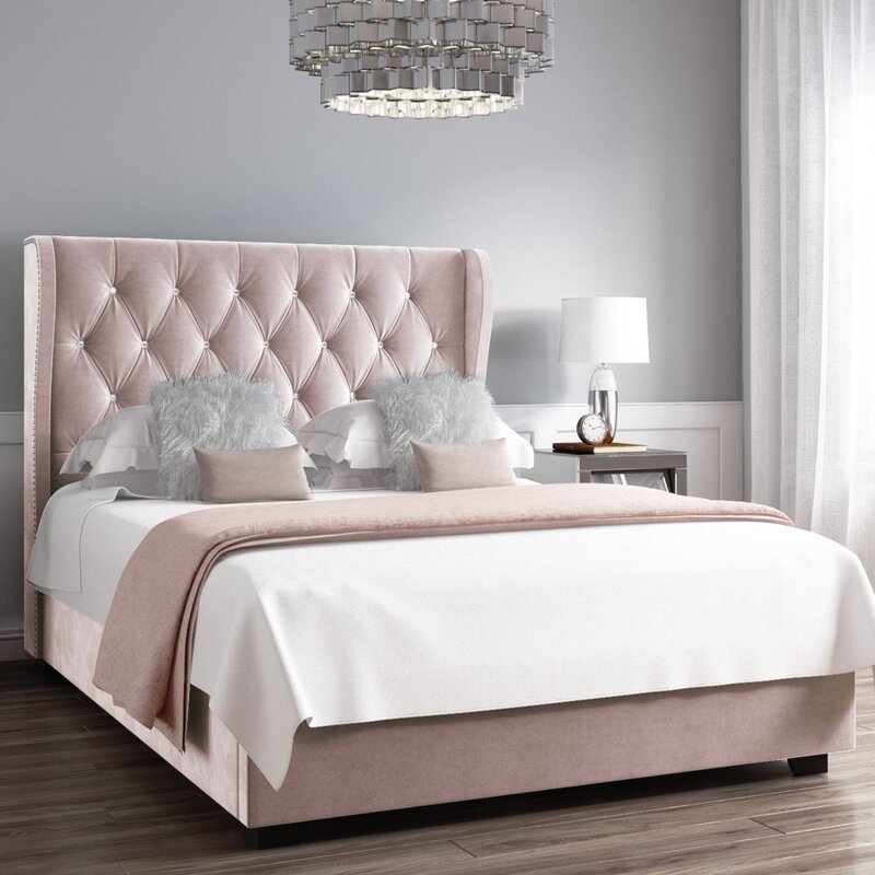 Bed with a pink headboard