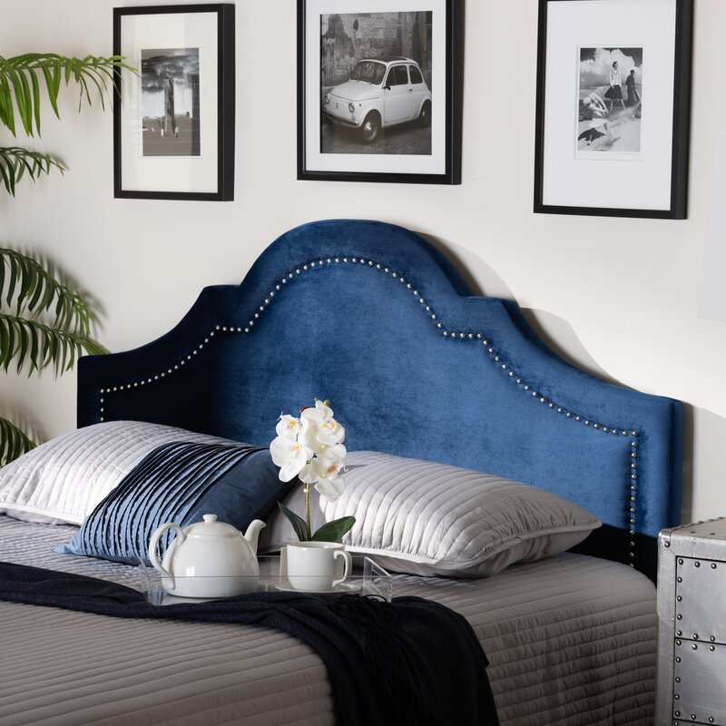 Bed with a blue headboard