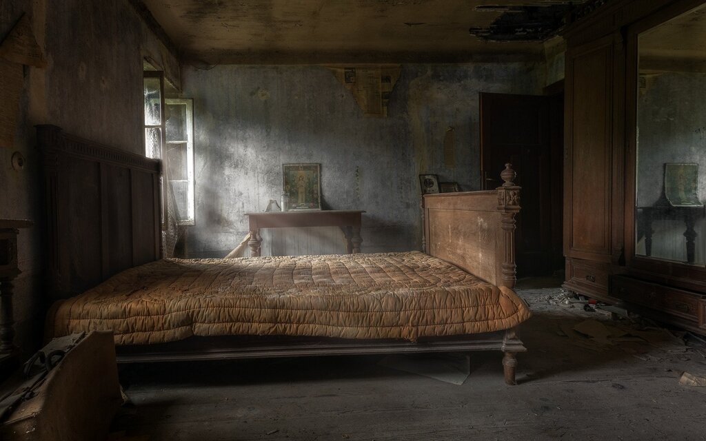 A bed in an abandoned house