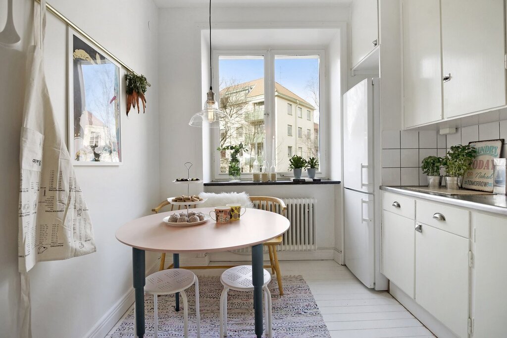 A round table in the interior of a small kitchen