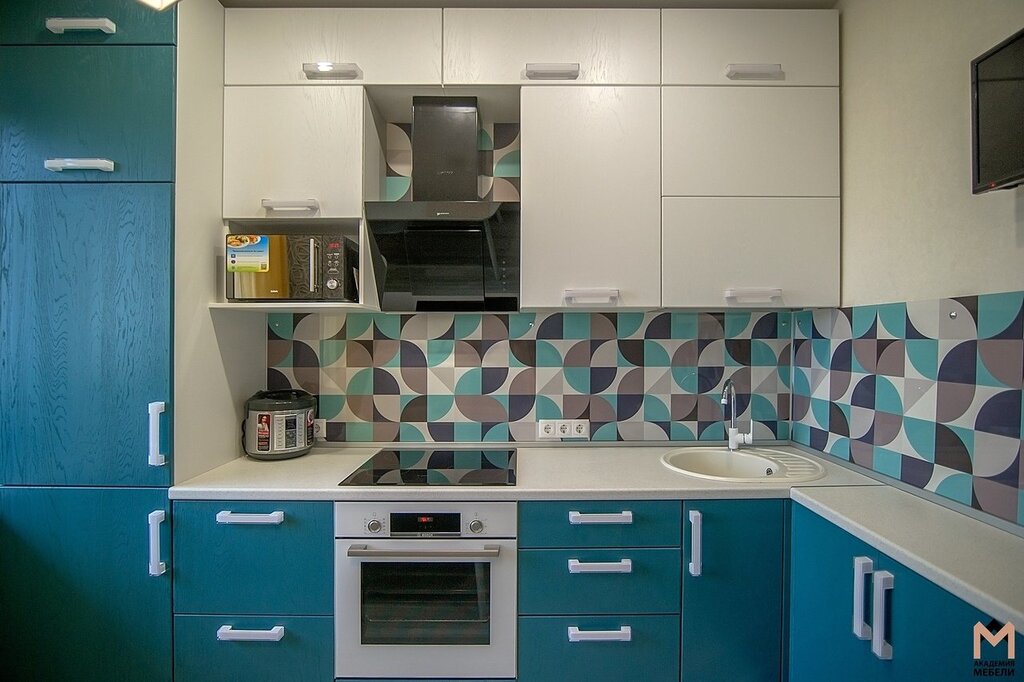 Kitchen with white upper cabinets and turquoise lower cabinets