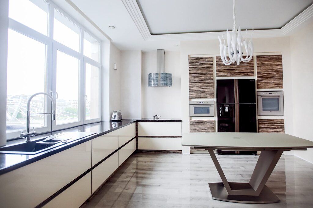 A kitchen without upper cabinets with a window