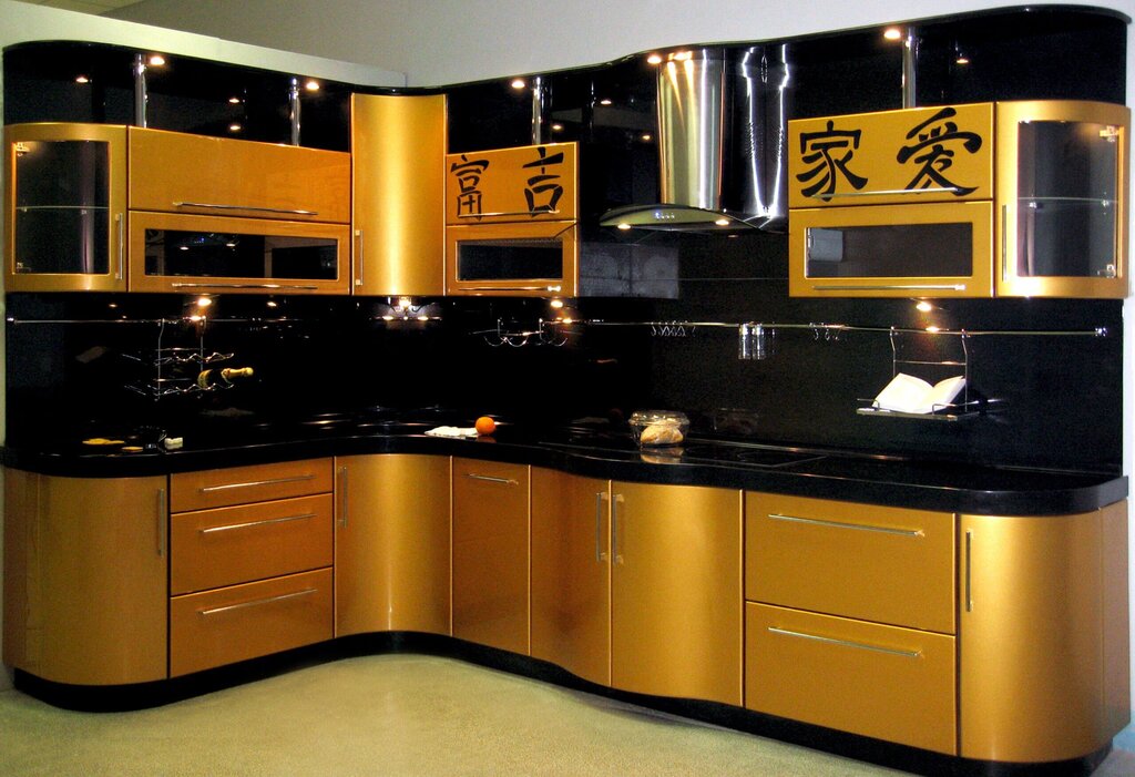 The kitchen is black with gold