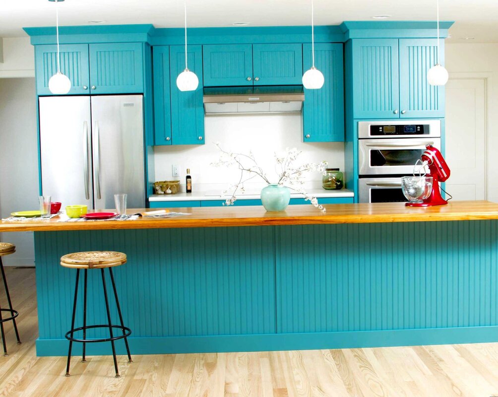 The kitchen is blue with wood