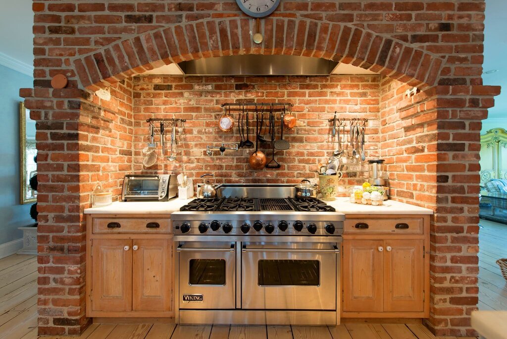 A brick kitchen in the house