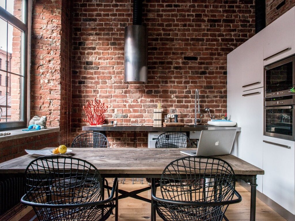 Loft kitchen with a brick wall