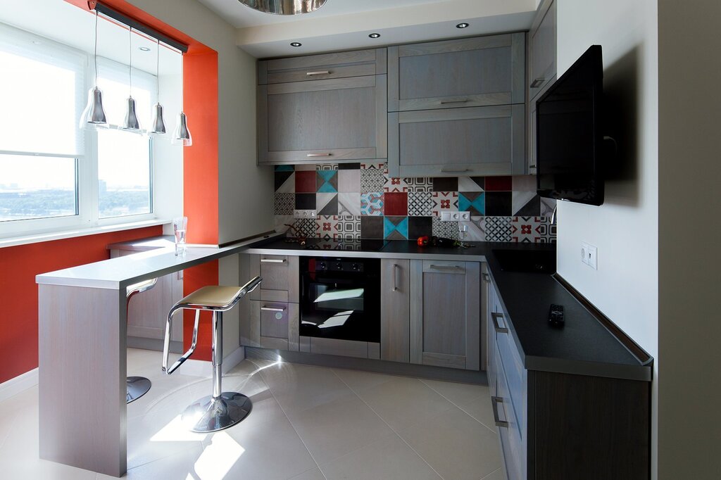 The kitchen on the balcony with a bar counter