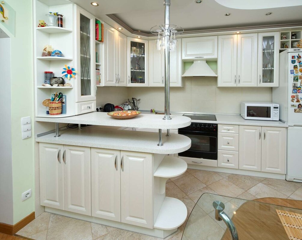 A kitchen with a bar counter by the window