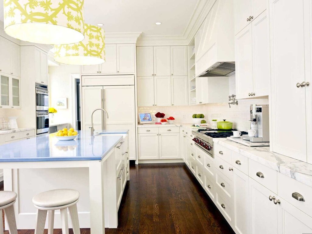 A kitchen with white furniture