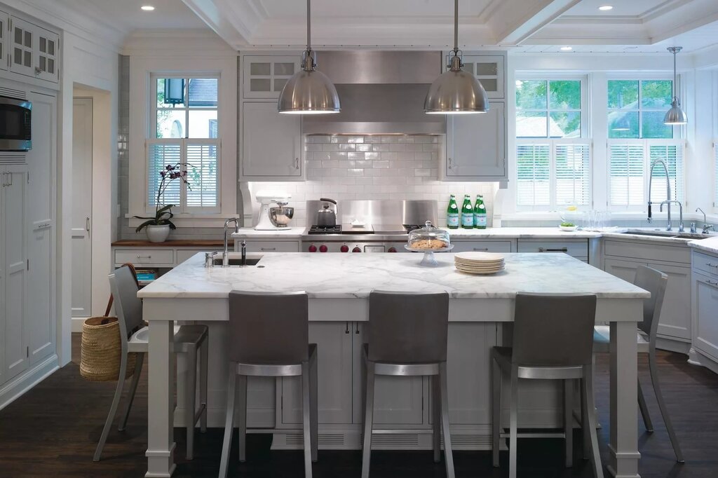 A kitchen with a large table