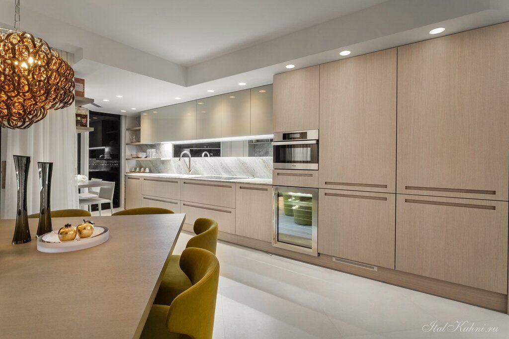 A kitchen with large cabinets