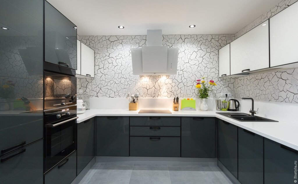 Kitchen with a black backsplash