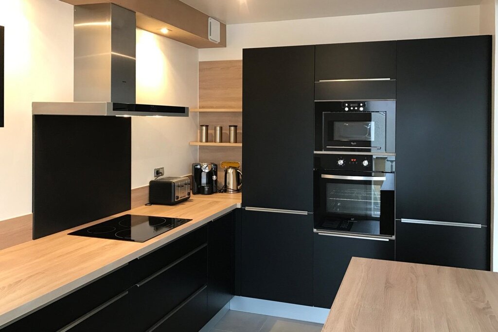 Kitchen with a black refrigerator