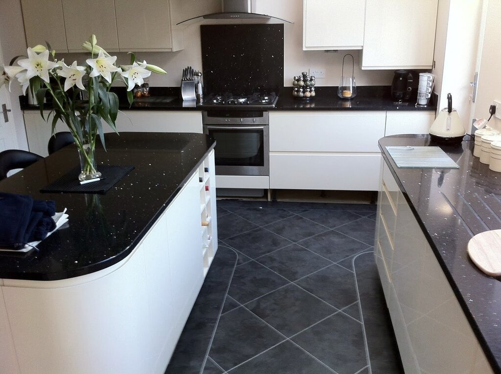 Kitchen with a black floor